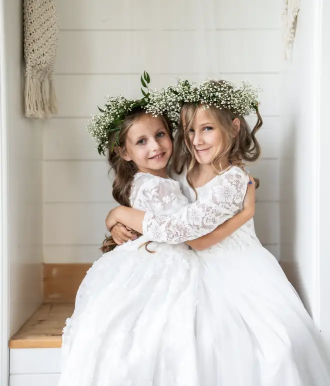 flower girls hugging each other